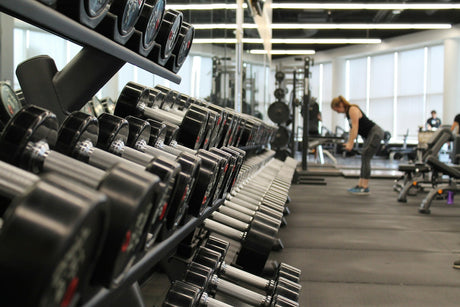 Strength training with barbells in a gym