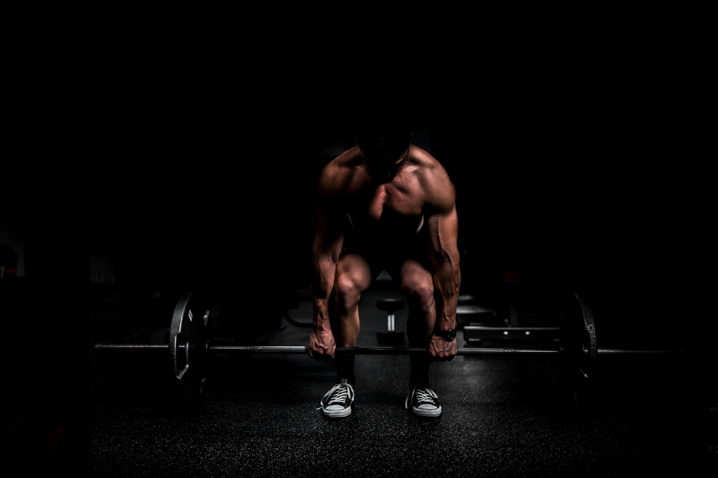 Athlete training for muscle growth in a gym